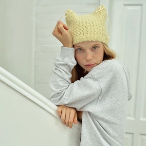 Cute beige knit cat ear beanie with ribbon bows for women in autumn and winter