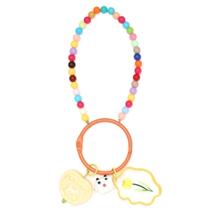 Macro detail of rainbow beaded keychain with sweet heart and tulip charms
