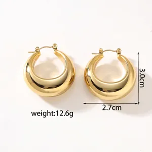 Detail view of 18k gold plated chunky C-hoop earrings with 3.0cm height dimensions