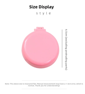 Detail showing the 6.5cm diameter dimension of the pink portable folding hairbrush