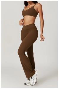 Macro shot of V-shaped waistband and flared slit hem on recycled yoga pants