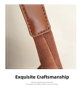 Detailed macro view showing precision stitching on dark brown leather and suede tote bag