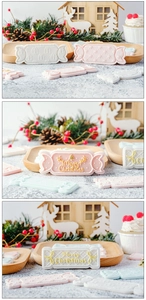 Detailed view of pink and white Christmas candy fondant molds with festive patterns