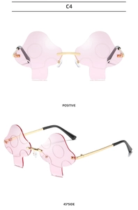 Detailed front and side views of C4 pink mushroom rimless sunglasses with gold metal frame