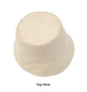 Top down flat lay of a minimalist creamy white PU leather bucket hat on white background