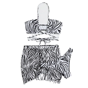 Three-piece zebra print bikini set with drawstring cover-up skirt and halter top