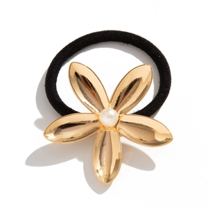 Elegant black ponytail holder with gold flower and pearl center on white background