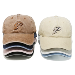 Vintage washed baseball caps with P embroidery in multiple colors and distressed finish