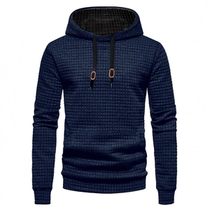 Men's navy waffle knit hoodie with long sleeves and black drawstrings on white background