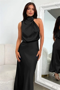Detailed close-up of smooth black satin fabric and elegant high-neck sleeveless evening gown
