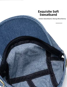Macro detail of cotton sweatband and adjustable metal buckle inside denim beret hat
