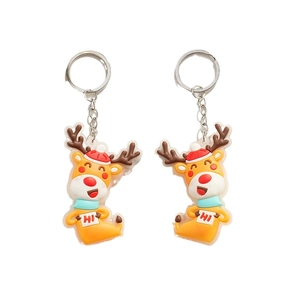 Set of two cartoon Christmas reindeer keychains with red hats and blue scarves