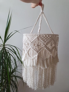 Close-up of handmade macramé lampshade with cotton rope textures and fringe tassels