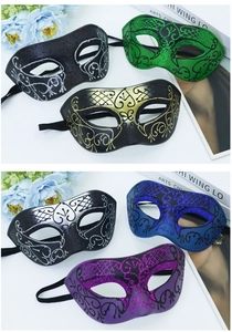 Detailed view of Venetian half-face party masks with glitter patterns and ribbons