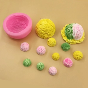 Pink silicone ice cream mold with multi-colored scoops on a beige background