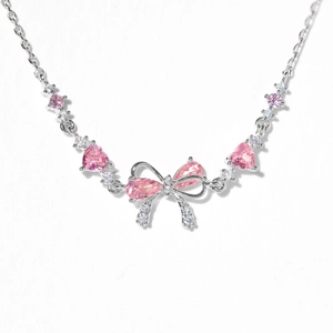 Elegant silver necklace with pink heart and teardrop gemstones and bow pendant