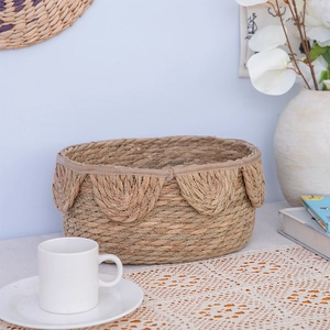 Handwoven Nordic seagrass storage basket with decorative petal rim for home desktop organization