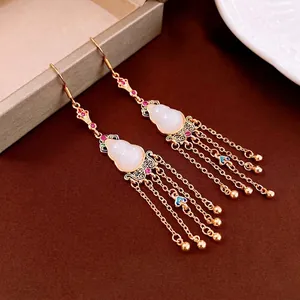 Gold-plated gourd tassel earrings with jade-like inlay and red crystal accents
