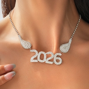 Close-up of sparkling silver 2026 pendant necklace with pave crystal rhinestones on a neck