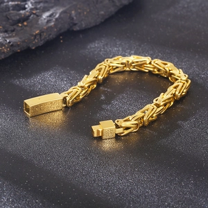 Men's gold-plated Byzantine chain bracelet with square clasp on black texture background