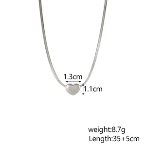 Detailed view of silver heart pendant dimensions 1.3x1.1cm on sleek snake chain