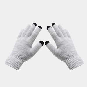 Detail of grey winter knit gloves featuring conductive touchscreen tips and ribbed cuffs