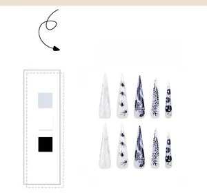 Détails des motifs de flammes argentées et d'araignées sur des faux ongles stiletto