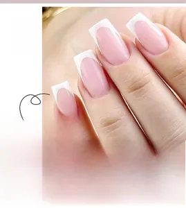 Detail view of French press-on nails in nude pink with white tips and hand model wear
