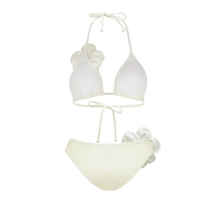 Detailed view of 3D satin flower accents on an ivory halter bikini set with ties