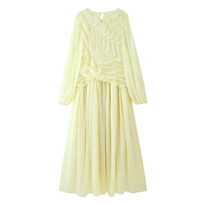 Detail view of diagonal pleated textures on pale yellow long sleeve chiffon maxi dress
