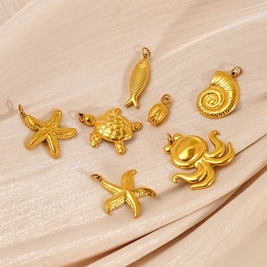 Gold-plated stainless steel ocean charms featuring sea turtle and starfish on silk