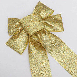 Detail of 23cm gold glitter Christmas bow with star sequins for festive party decor