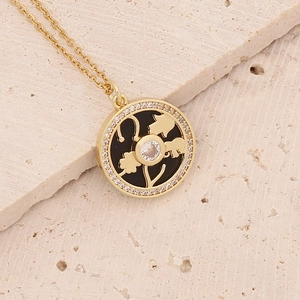 Macro detail of 18K gold-plated elephant pendant with micro-pave cubic zirconia inlay