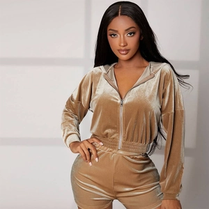 Detailed texture of velvet hoodie and high-waisted shorts set with a metal zipper