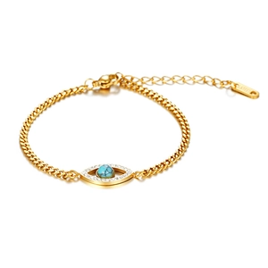 Detail of 18K gold stainless steel bracelet featuring turquoise Evil Eye and zircon stones