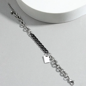 Men's two-tone stainless steel chain bracelet with a blank silver rectangular tag