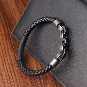 Men's hand-woven black leather bracelet with dark grey metal chain on leather wallet
