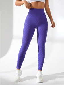 Detail shot of purple high-waisted leggings featuring seamless diamond lattice texture fabric