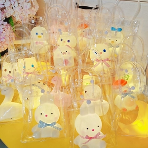 Cartoon animal night lights in transparent PVC bags featuring cute rabbit and pig shapes