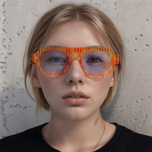 Detail of orange striped retro sunglasses with light blue lenses on female model