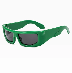 Detail view of bold green rectangular sunglasses with grey lenses in Y2K cyberpunk style