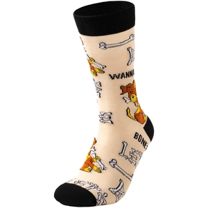 Detail of beige knit socks with orange cartoon dog patterns and black reinforced heel