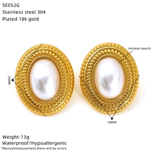 Macro detail of vintage oval pearl earrings in 18K gold plated stainless steel