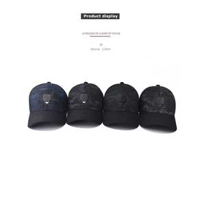 Detail of four camouflage baseball caps with lightning shield badges in various colors