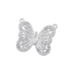 Detailed view of silver bow-shaped pendant with cubic zirconia and marquise center stone