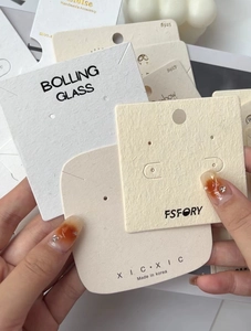 Close-up of premium textured jewelry display cards for earrings and necklaces