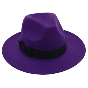 Detail view of deep purple wool felt fedora featuring a black grosgrain ribbon bow