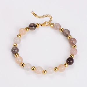 Detailed view of multicolor agate bead bracelet with golden metal spacers and lobster clasp