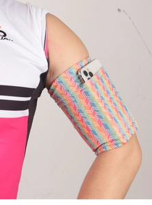 Close-up of elastic sports armband with colorful chevron pattern holding a smartphone