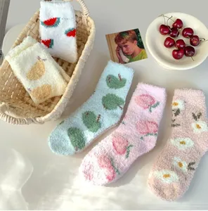 Soft coral fleece socks set with fruit patterns displayed in a cozy lifestyle setting